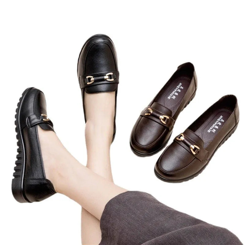 Black soft-leather casual pumps with round toe, low flat heel, and rubber sole.