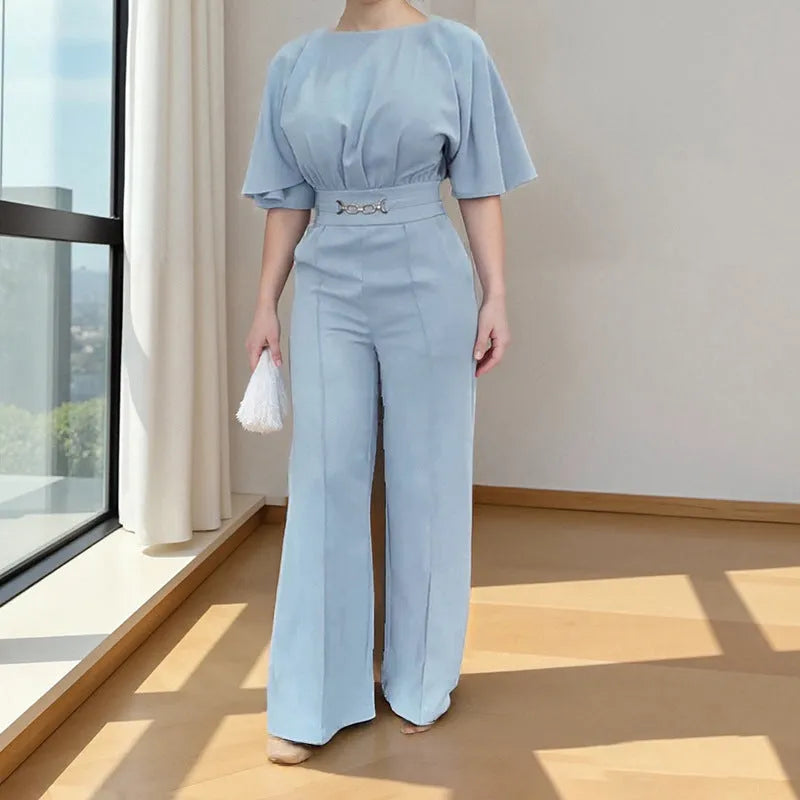 Blue men's two-piece polyester suit set with long-sleeved jacket and trousers on a hanger.