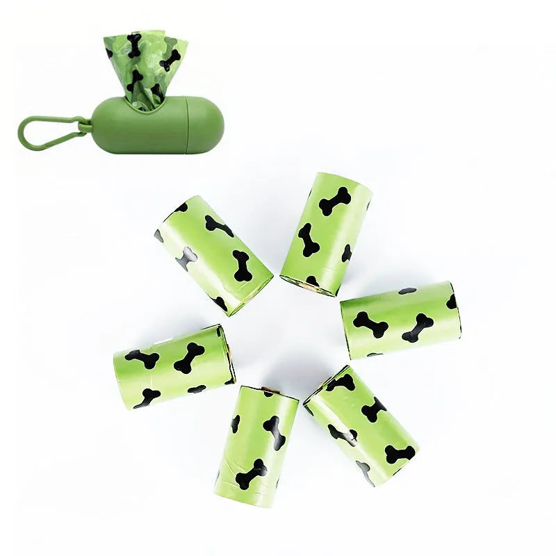 Biodegradable thickened dog poop bags in black and green on a roll with dispenser for pet waste cleanup.