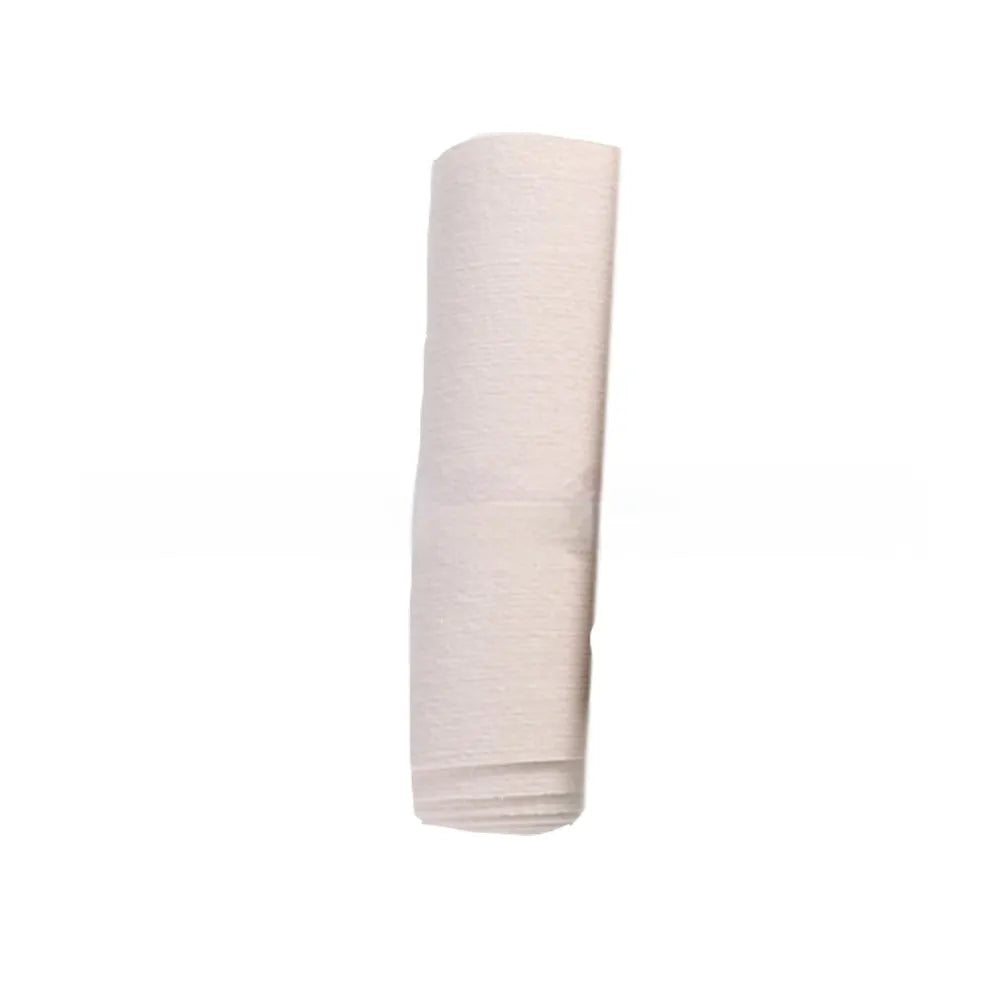 Self-adhesive cat scratch carpet mat in beige, trimmed to fit sofa arm, with scissors and roll packaging