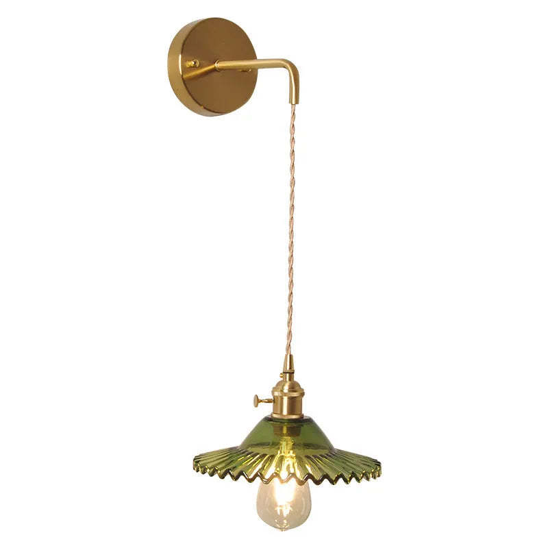 Retro copper Lotus wall lamp with a glass shade in a choice of six colours on a wall.