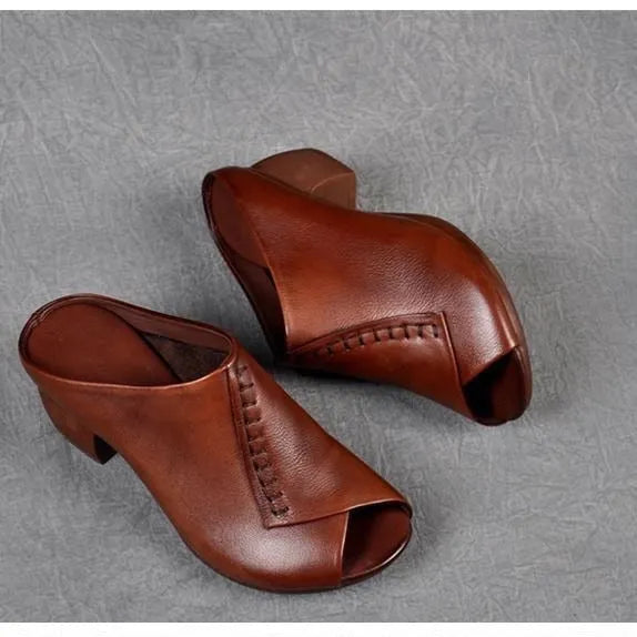 Women's black square heel peep-toe slippers showing fish mouth scaffold design and rubber sole