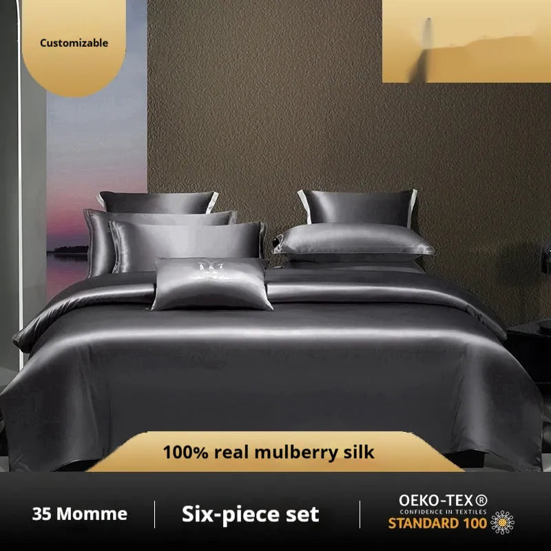 A silk four-piece quilt cover set in a solid colour, shown on a bed with matching sheets.