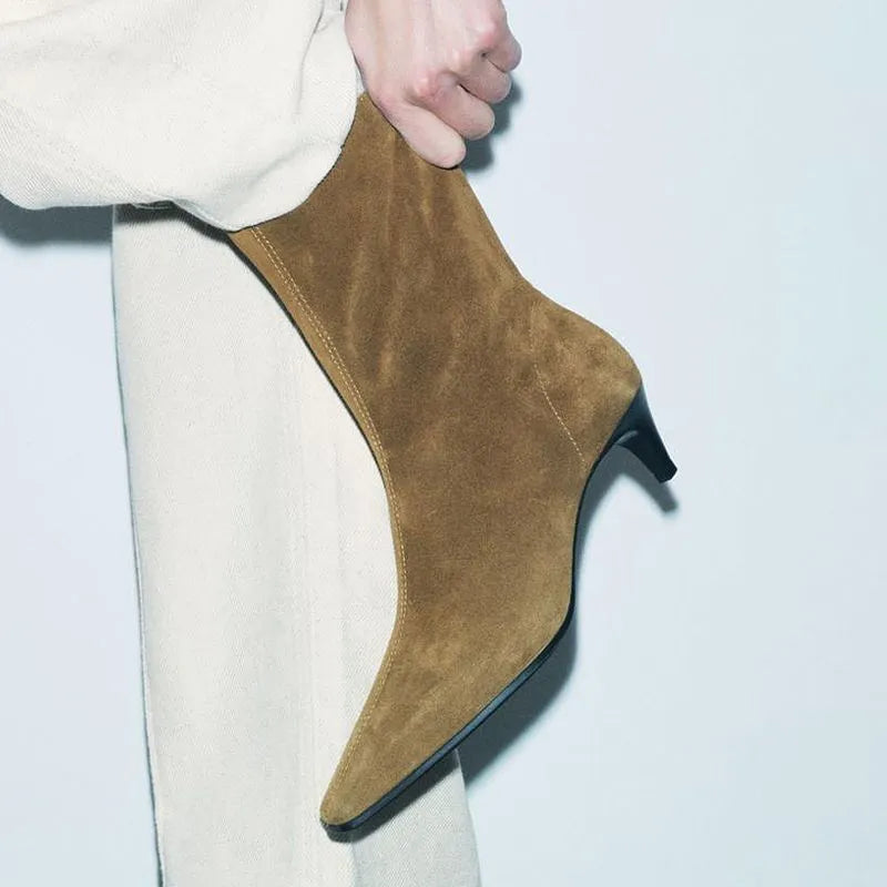 Brown square toe ankle boots with side zipper and kitten heels on a waterproof platform sole