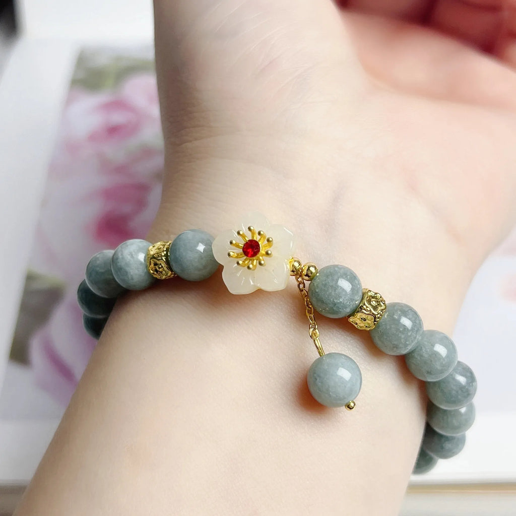 Women's handmade jade bracelet with adjustable rope fastening in retro style