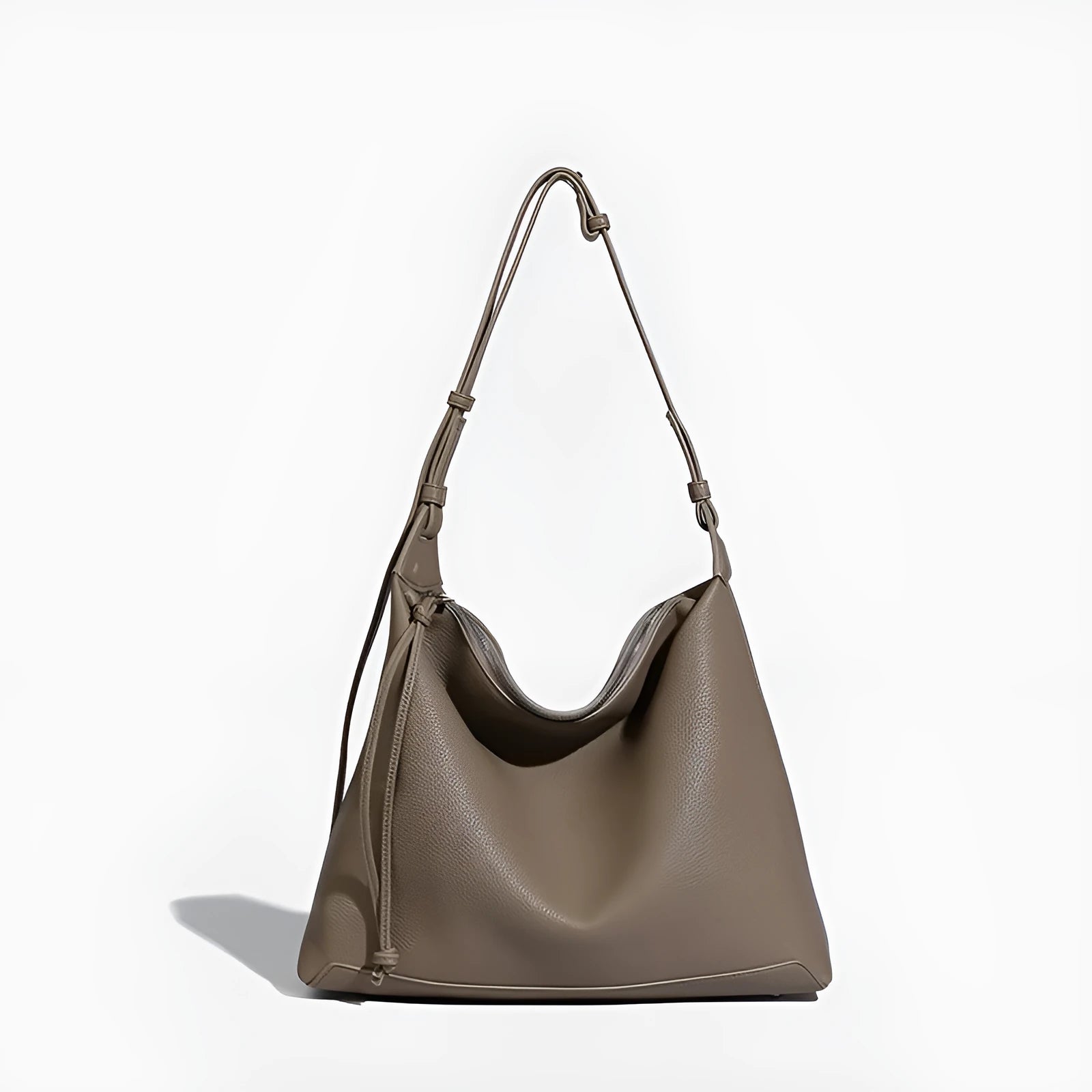 Soft PU leather messenger bag in caramel colour showing large capacity and shoulder strap.