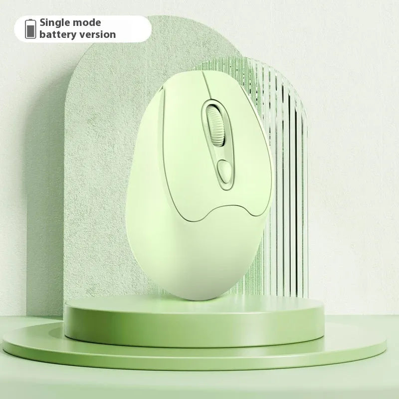 Bluetooth wireless mouse in choice of girl pink, milk tea pink, grey or green colours on a desk next to a laptop.