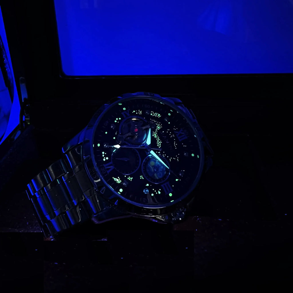 Automatic mechanical men's watch with rose gold case, black dial, and stainless steel bracelet.