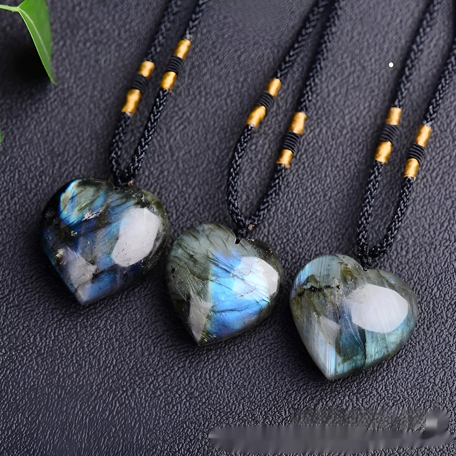 Light blue labradorite moonstone heart pendant necklace on a chain, geometric crystal design.