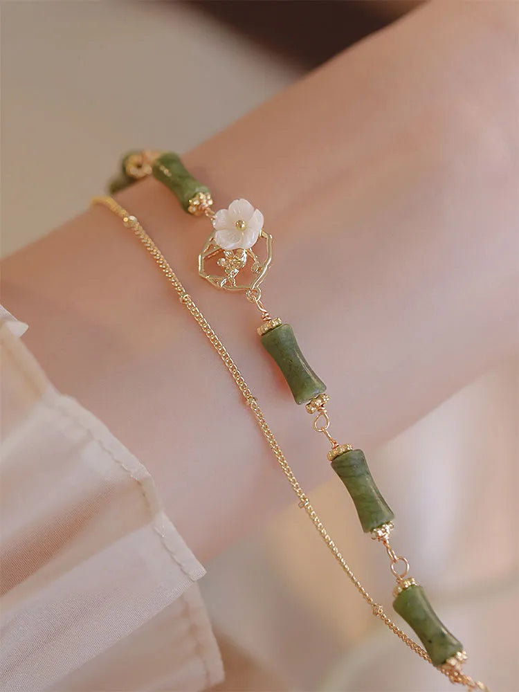 Natural olivine bracelet with Chinese double layer design featuring twin Bells of Ireland elements