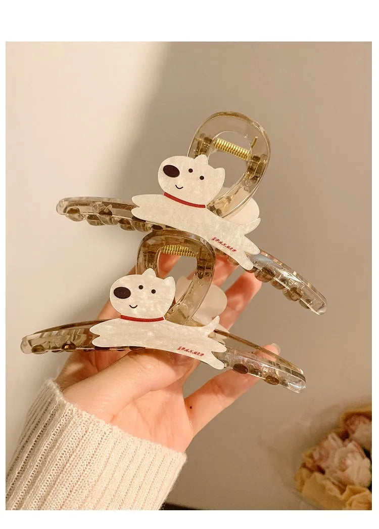 Cute cartoon puppy shaped hair barrettes with a grip clip, shown in beige and brown colours.