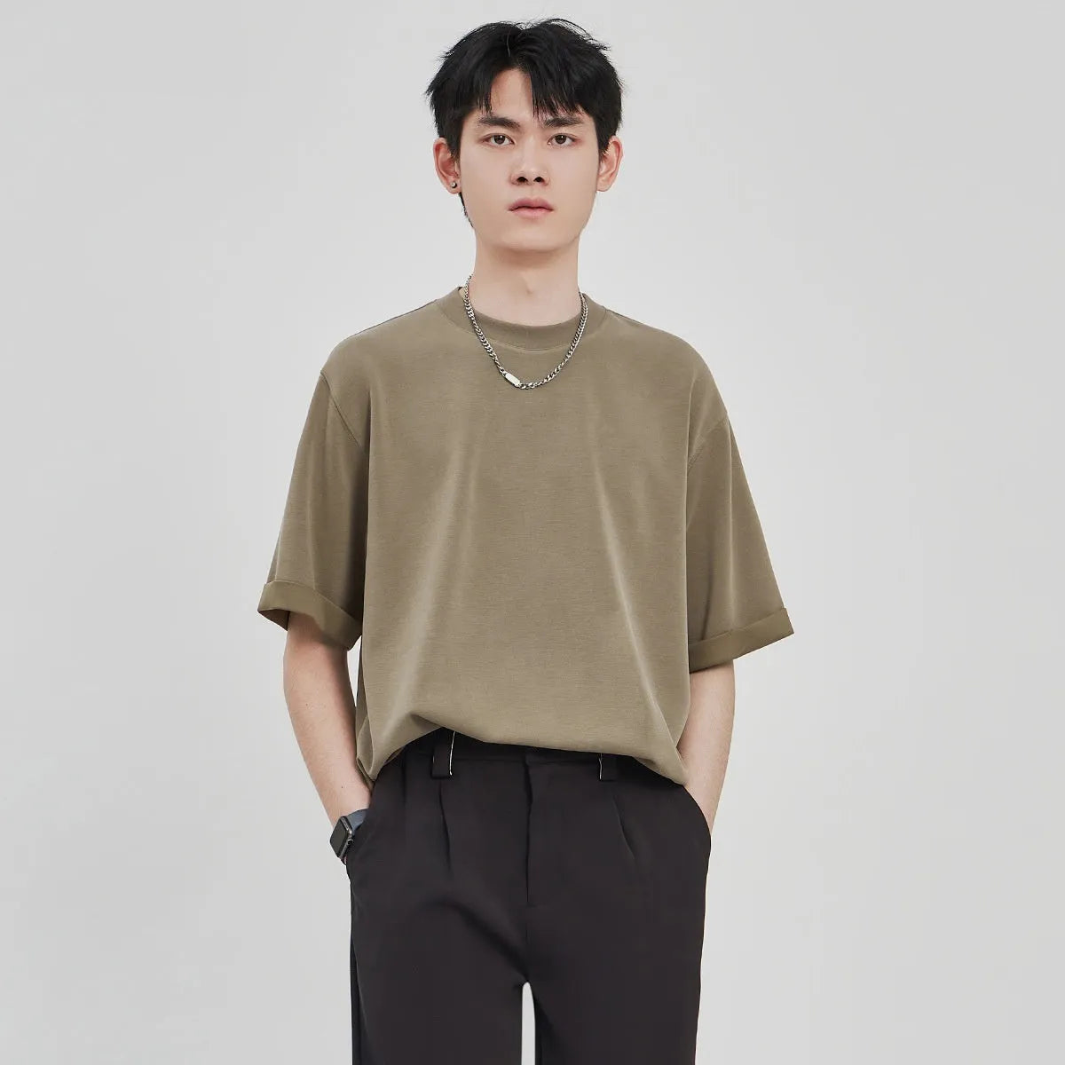 Men's drape knit loose fit t-shirt in polyester blend fabric showing black, brown, and white colour options