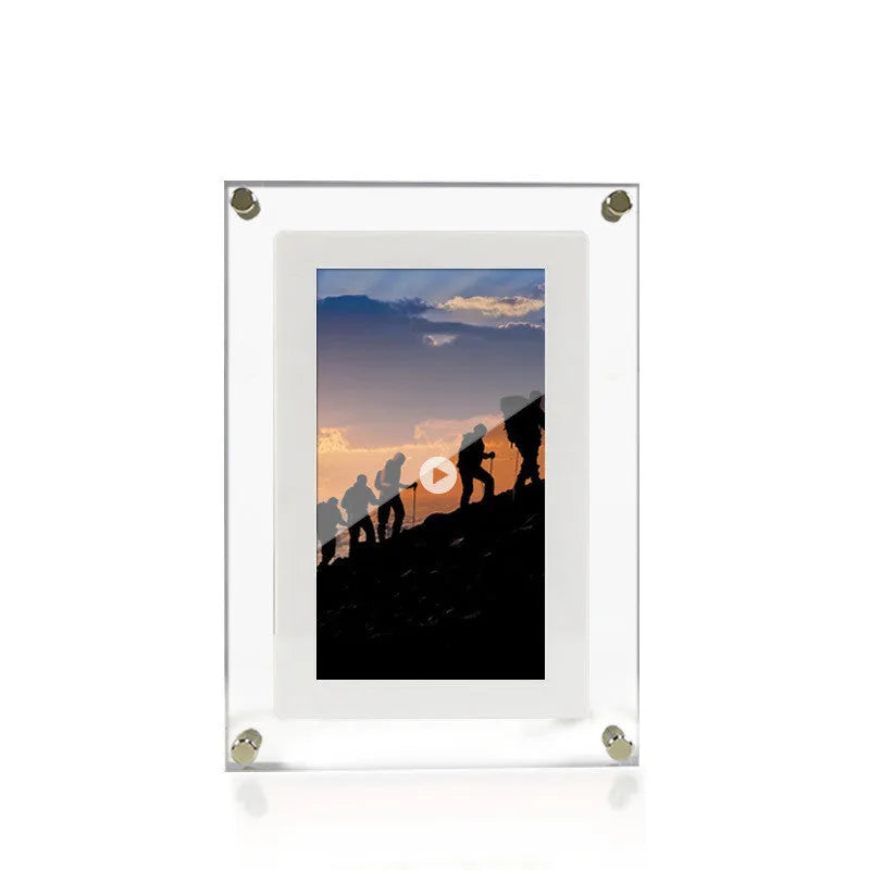 White vertical digital picture frame with acrylic casing on a table, showing a family photo on screen.