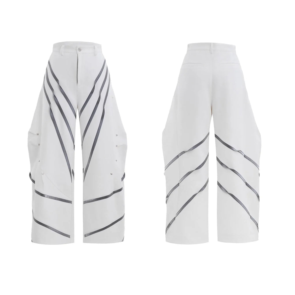 Men's polyester trousers with pleats and metal rivet detailing, shown in black and white colour options.