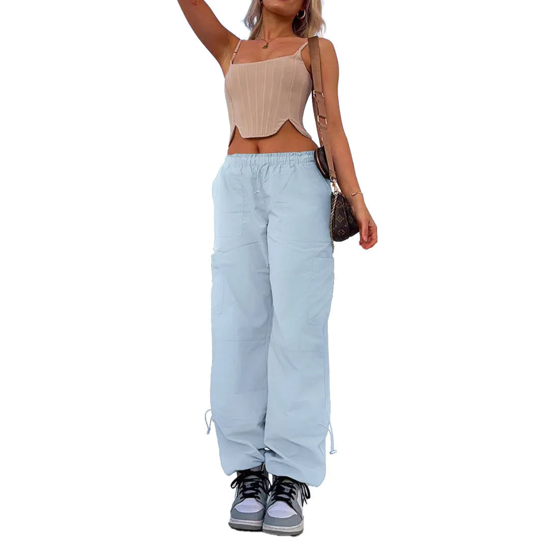 Multi-pocket straight-leg cargo casual pants in a light blue colour on a neutral background.