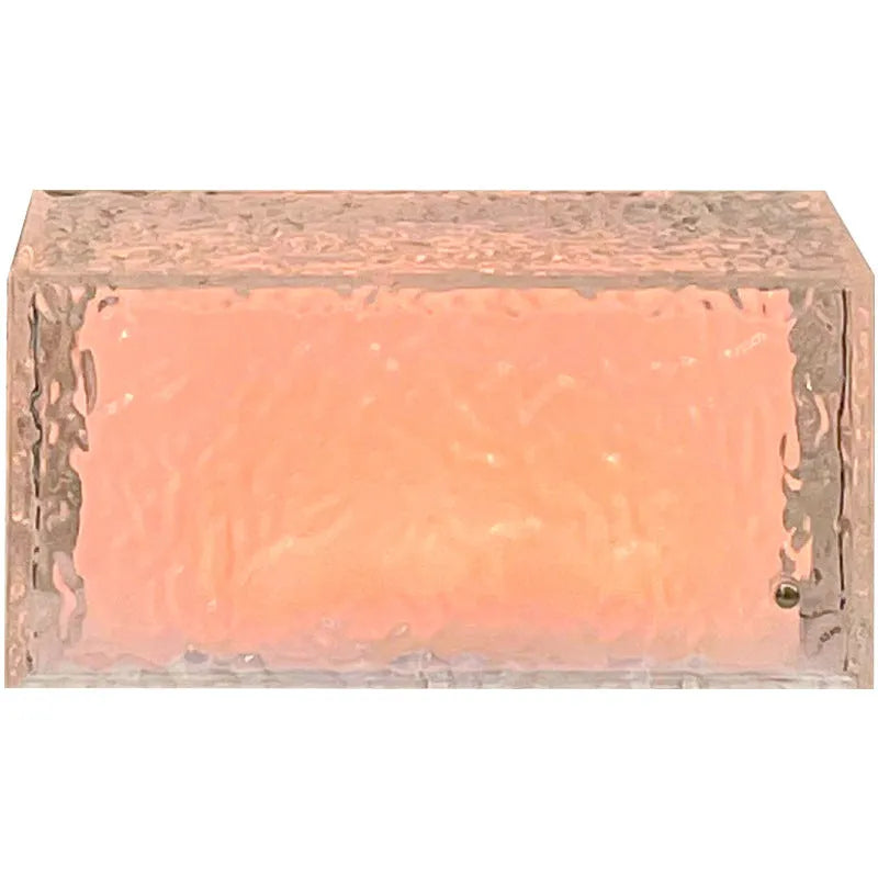 Geometric ice cube shaped acrylic night lamp with colour changing lights on wooden surface