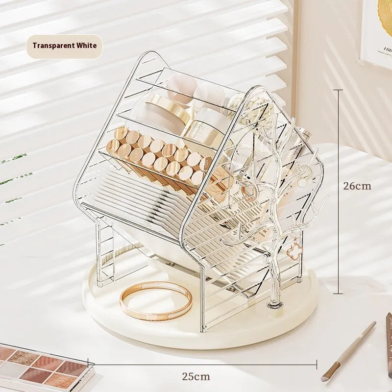 Rotating clear plastic cosmetics storage box with tiered compartments for brushes and bottles.