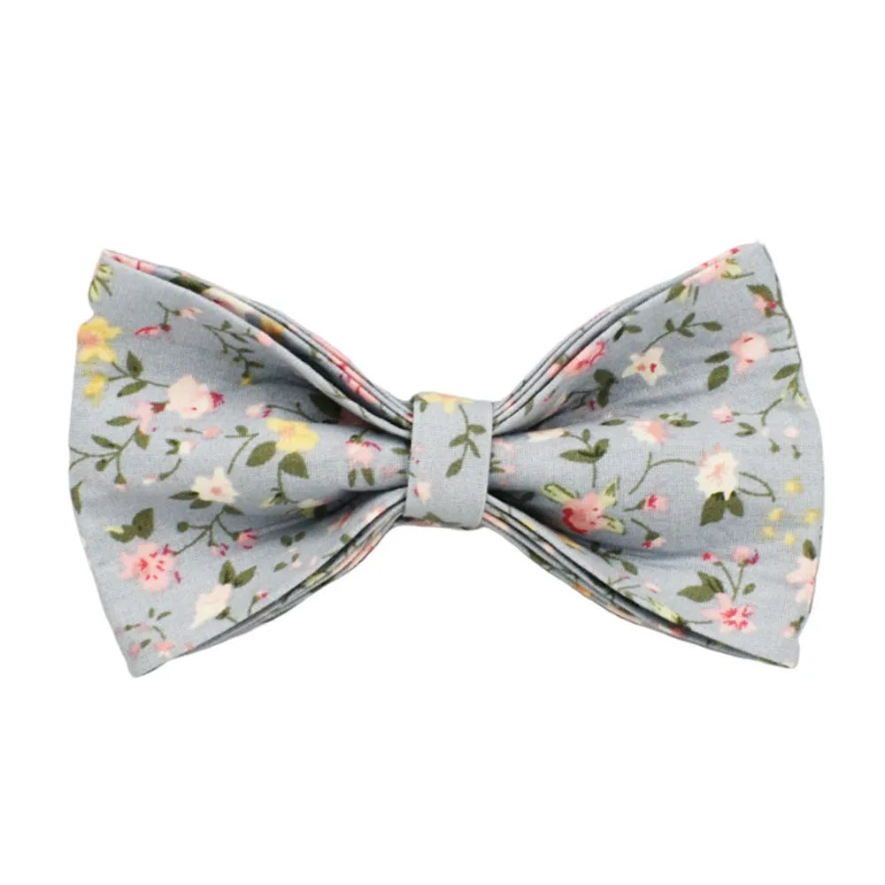 Blue floral patterned dog collar set with matching leash, bow, vest, and poop bag accessories