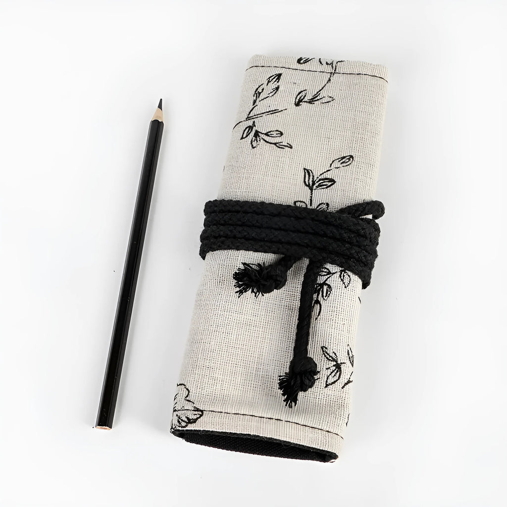 Black peony floral print canvas pencil roll bag unrolled to show 24 or 72 holes for pens.