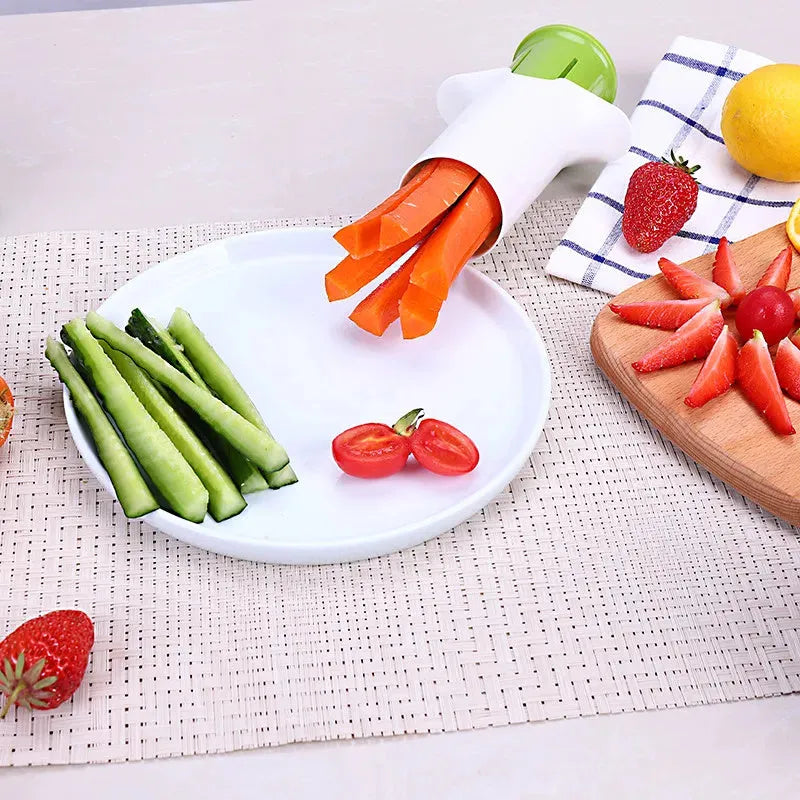 White vegetable cutter with six stainless steel blades for slicing cucumbers, carrots and strawberries