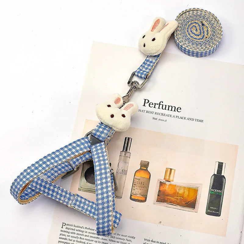 Small dog harness and lead set in blue with quick-release buckles and adjustable nylon straps.