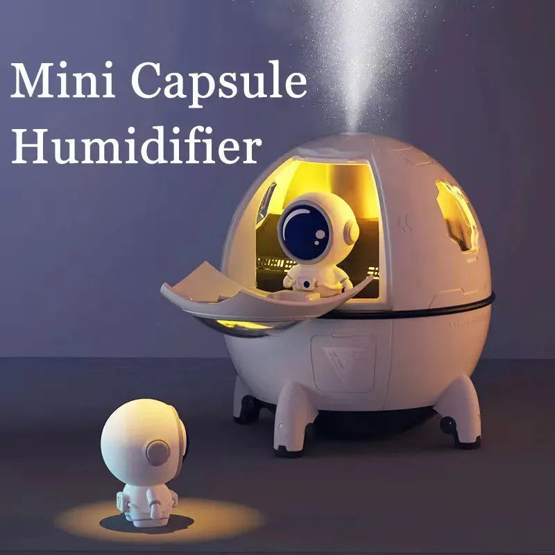 Light purple astronaut-shaped USB desktop humidifier with LED light on a desk