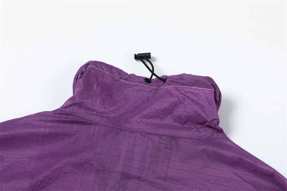 Men's thin loose sun protection jacket in black nylon fabric with pockets, worn casually outdoors