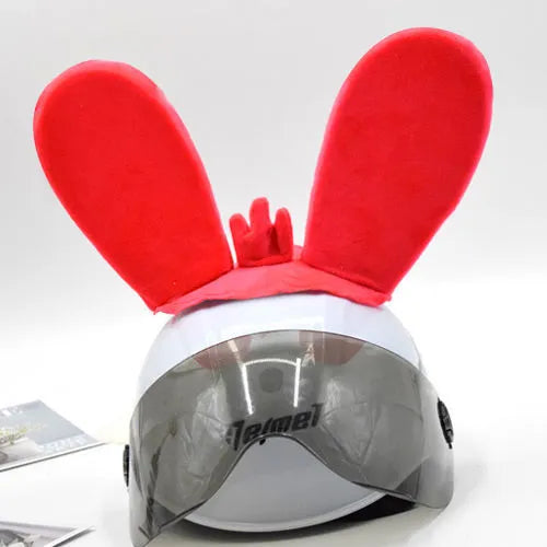 Rabbit Glow helmet decoration with Velcro bottom on a ski helmet, shown in blue LED style.