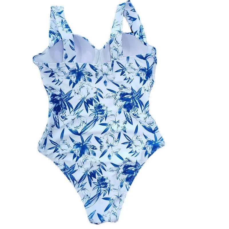 One-piece white polyester ladies swimsuit with printed pattern and gather design, sleeveless
