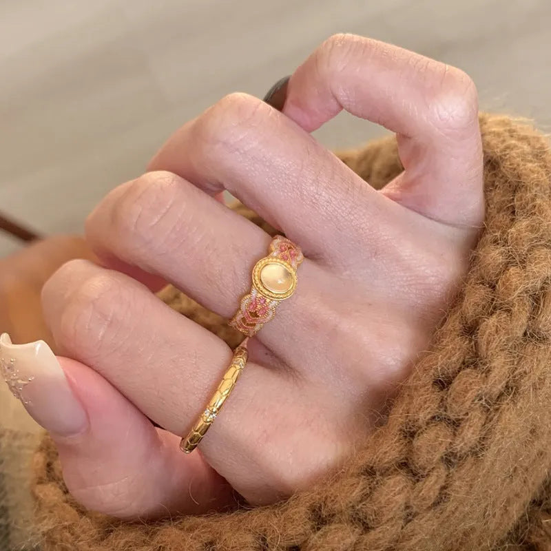 Geometric open-mouth ring with pink crystal enamel decoration on gold-plated copper band