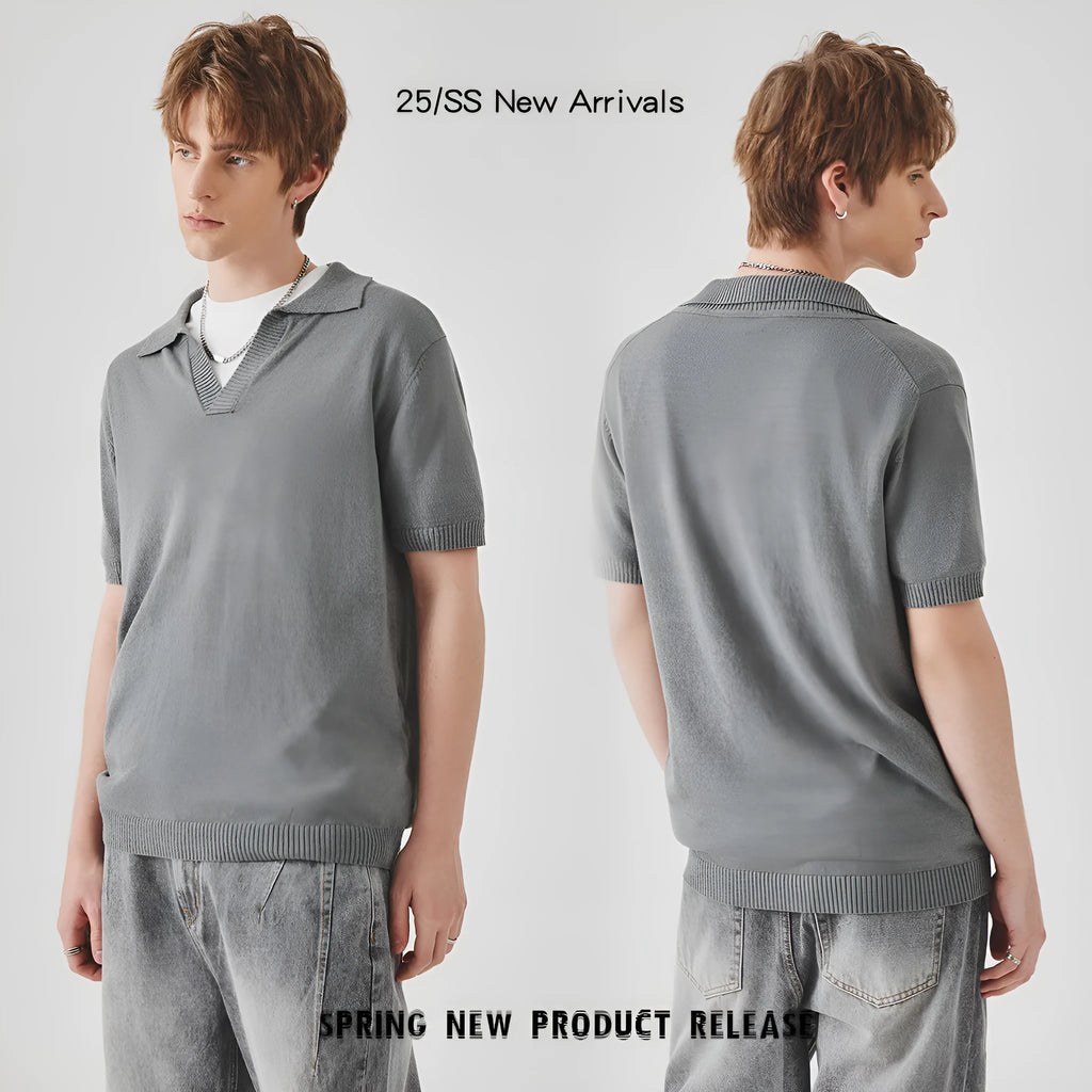 Man's short-sleeved knitted polo t-shirt in a solid colour on a hanger.