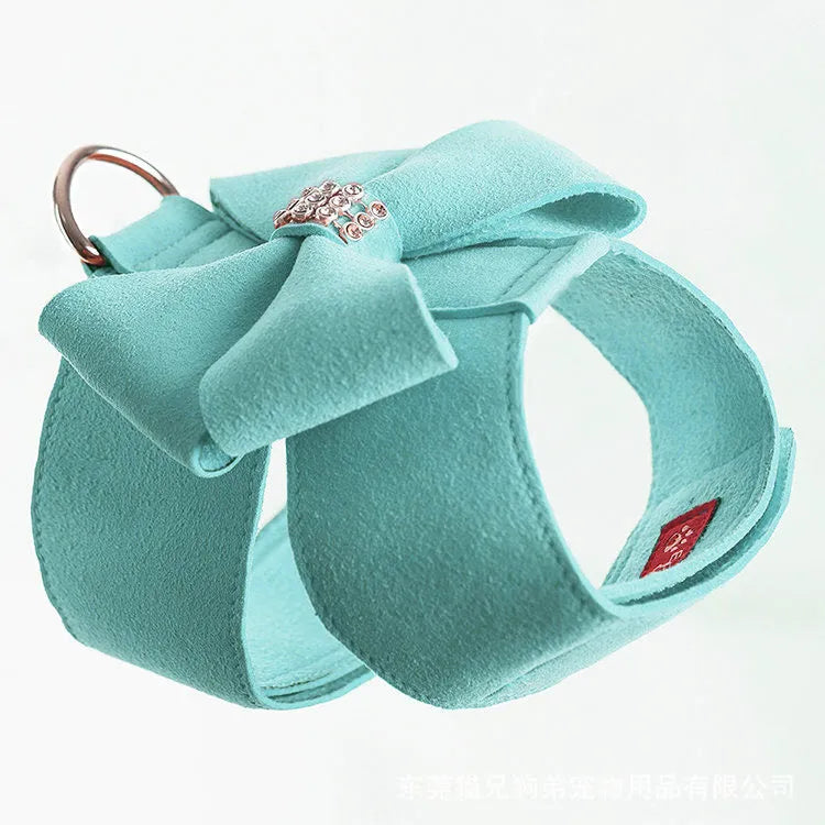 Puppy wearing microfiber chest strap with bowknot design in pink, blue, or orange colour