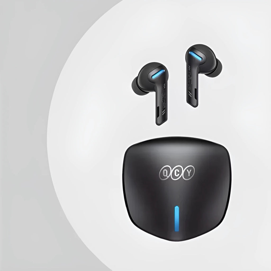 Grey QCY-G1 wireless Bluetooth gaming headset with charging case and ear tips