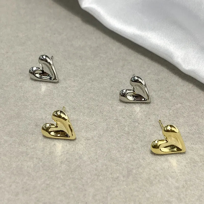 Simple heart-shaped metal drop earrings in gold and silvery colour options
