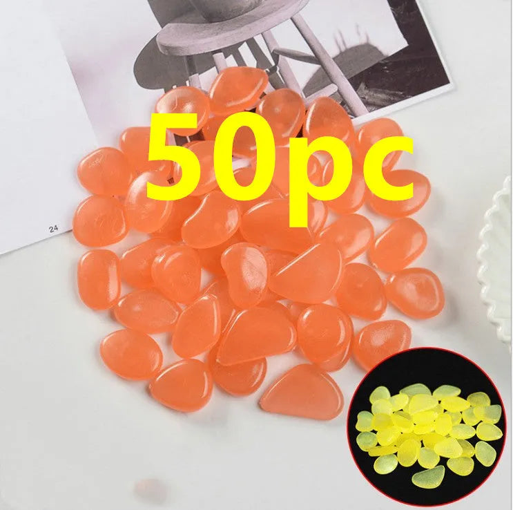 Luminous fluorescent aquarium and garden pebbles in mixed colours including dark purple, yellow, light blue, pink, orange