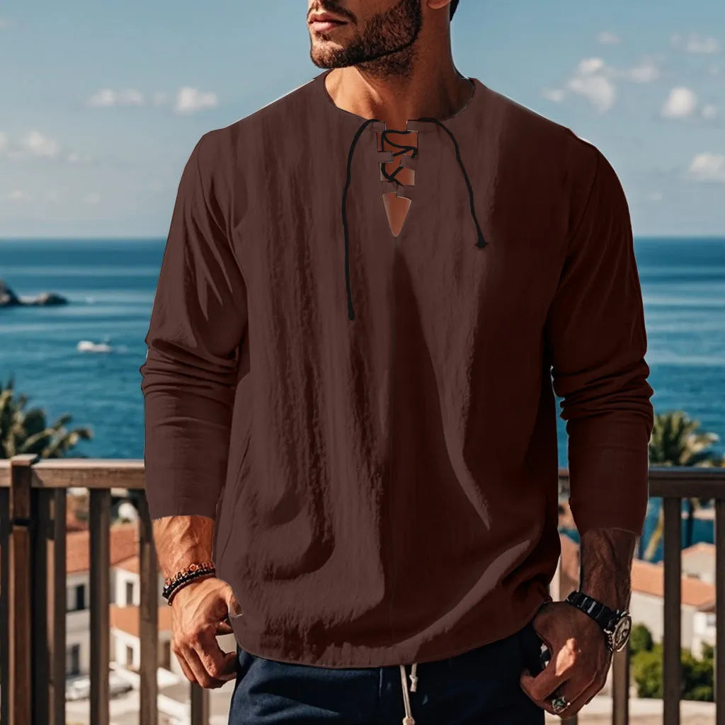 Man wearing a loose fit solid colour cotton linen beach shirt in a casual setting.