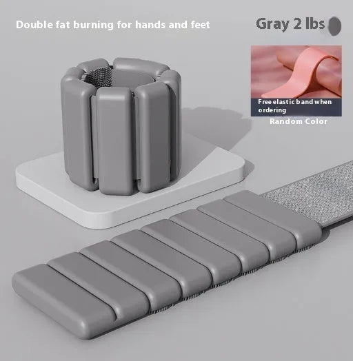 Silicone fitness weight bracelet with Velcro strap shown in pink, black, grey, and blue colour options.