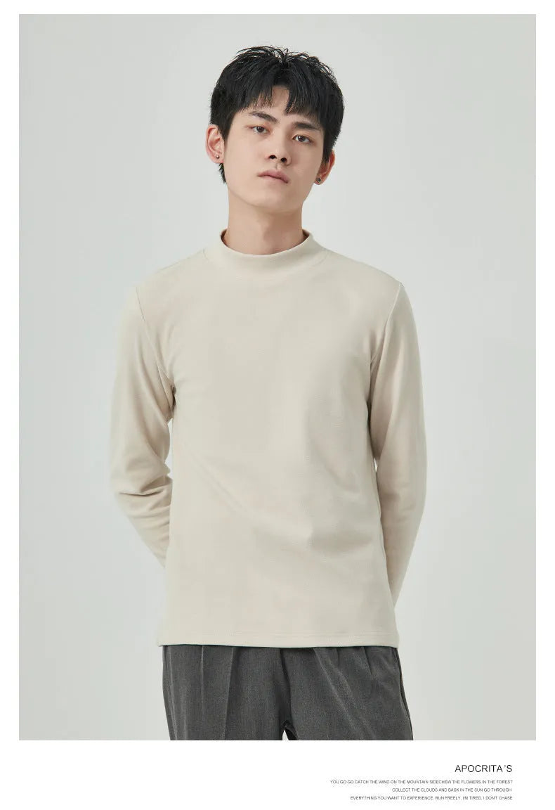 Men's brown Dralon fabric long sleeve t-shirt with a half-high collar on a hanger.