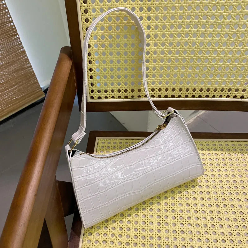 Small women's underarm shoulder bag with crocodile pattern, PU material, and zipper closure in beige