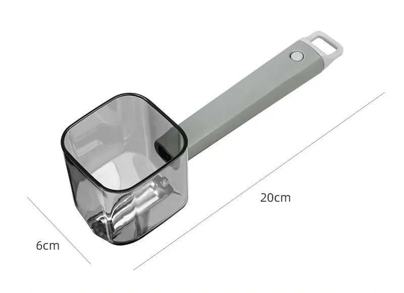 Green, grey, and red stainless steel kitchen peelers with plastic handles on a white background.