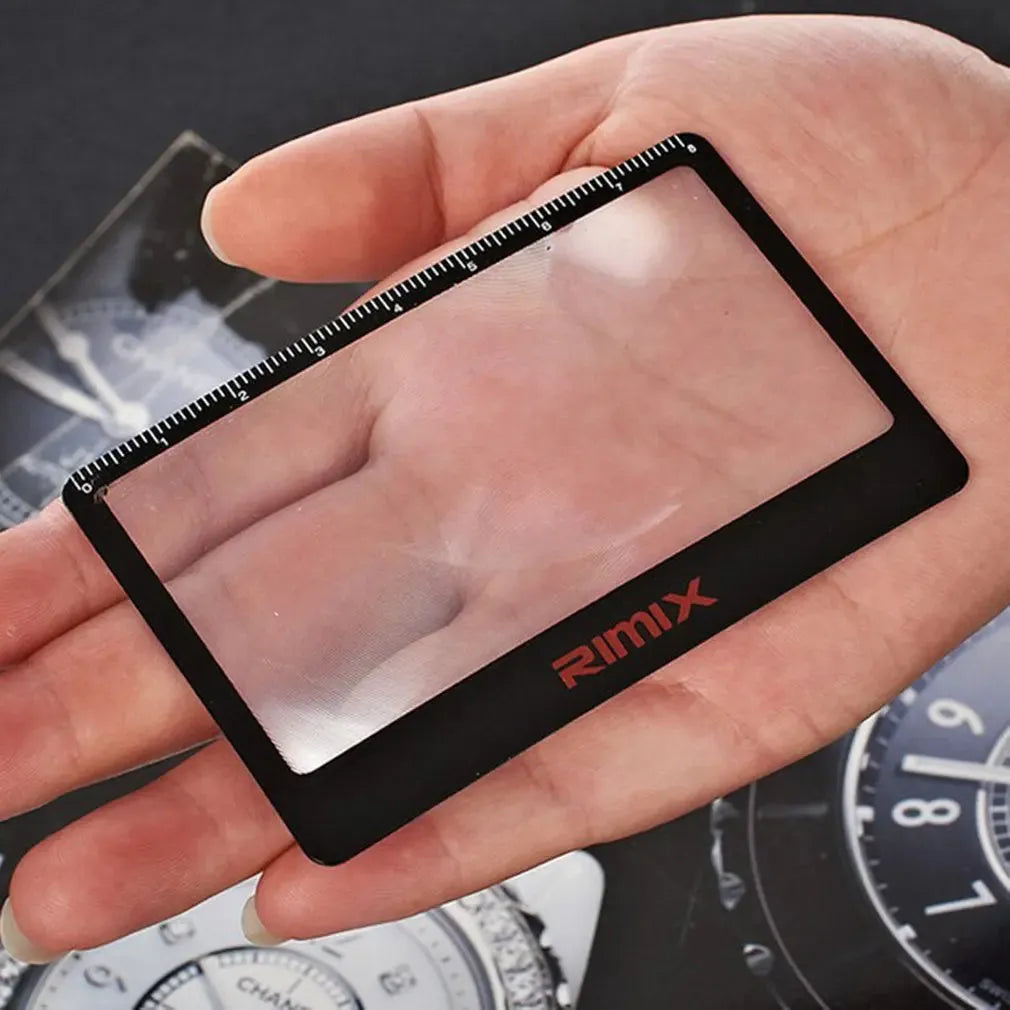 Black and white credit card-sized plastic magnifier for portable reading assistance