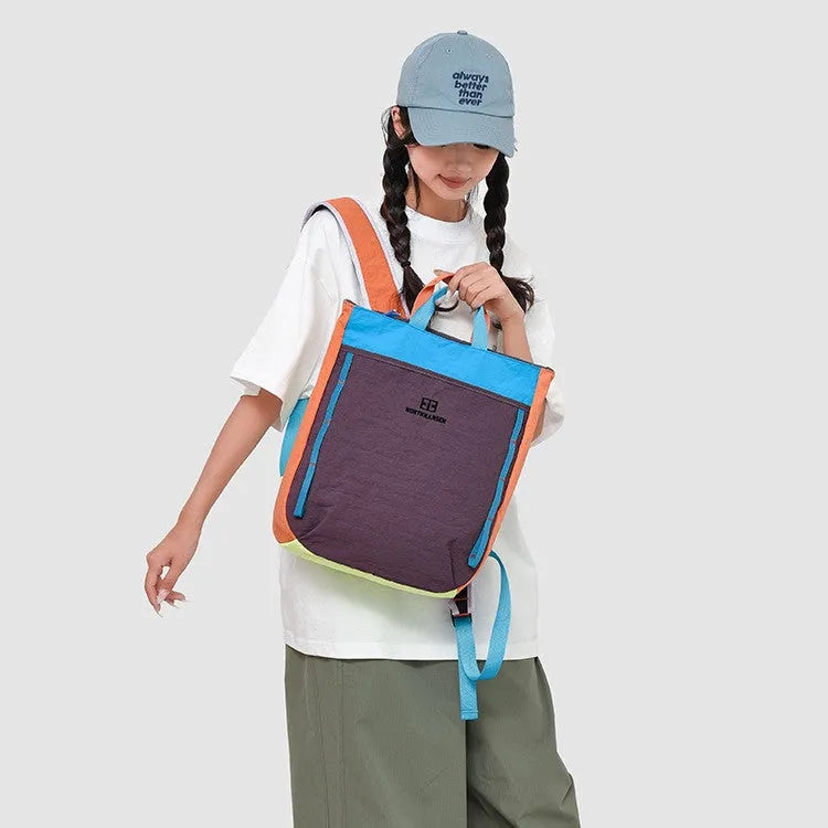 Women's casual large capacity nylon backpack with aropillow straps in black and red combo for leisure travel