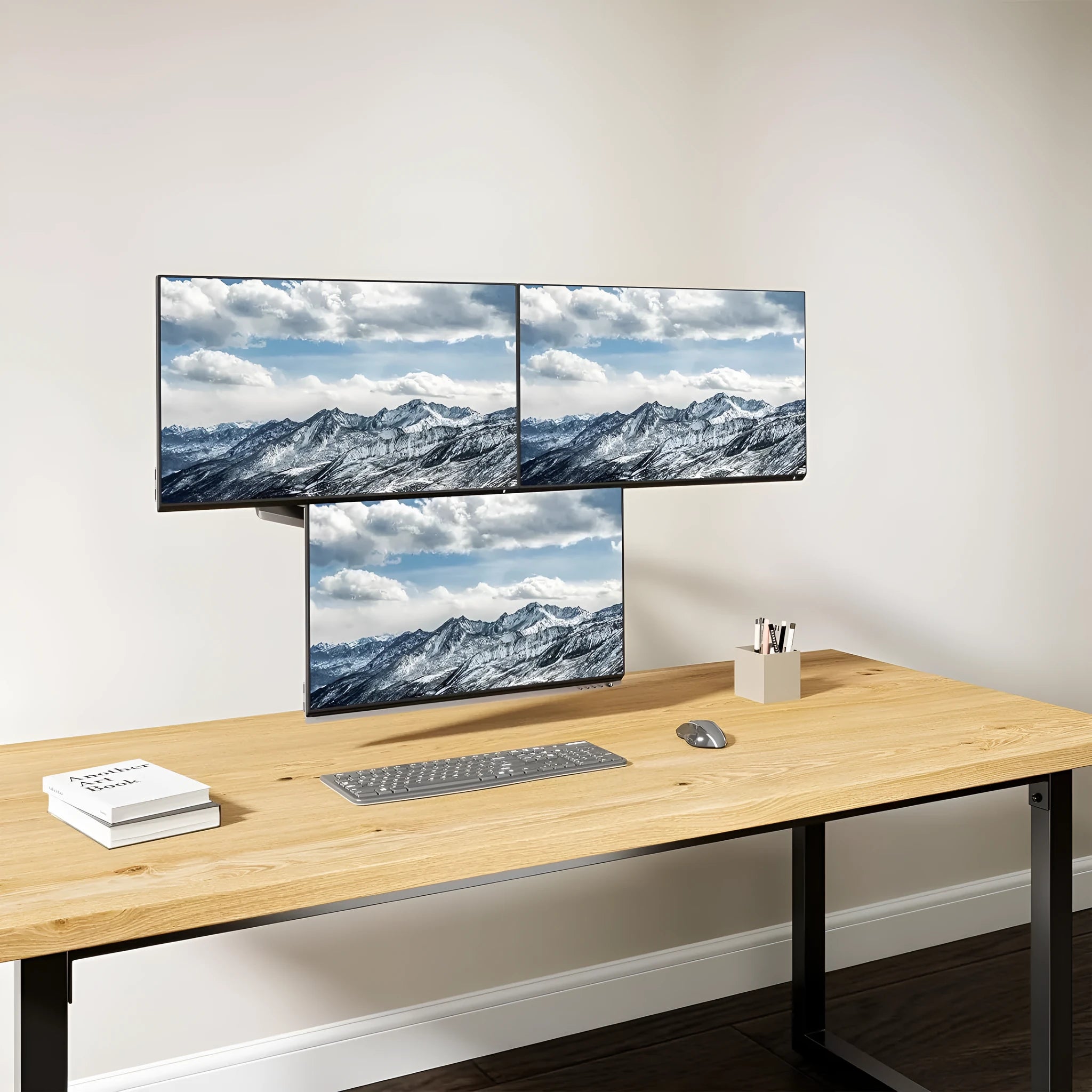 Black three-arm gas spring monitor mount for 13 to 27 inch computer screens