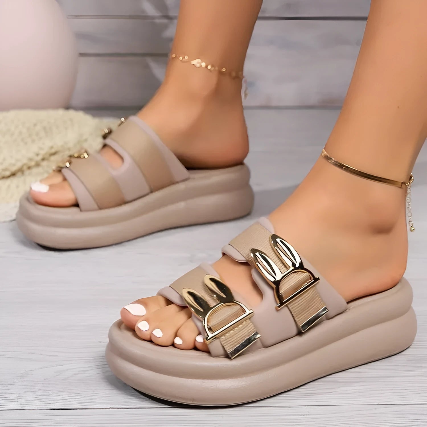 Women's suede slippers with a thick rubber sole in apricot, black, and off-white.