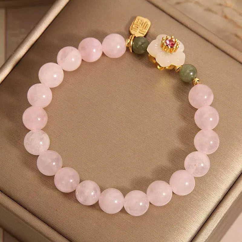 Crystal Hetian jade beaded bracelet with peach blossom design and camellia fruit elements