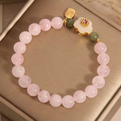 Crystal Hetian jade beaded bracelet with peach blossom design and camellia fruit elements