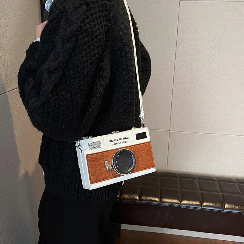 Soft PU mini crossbody camera bag in a horizontal square shape with a single strap.
