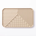 Silicone pet licking mat with textured surface and suction cup base in pink colour