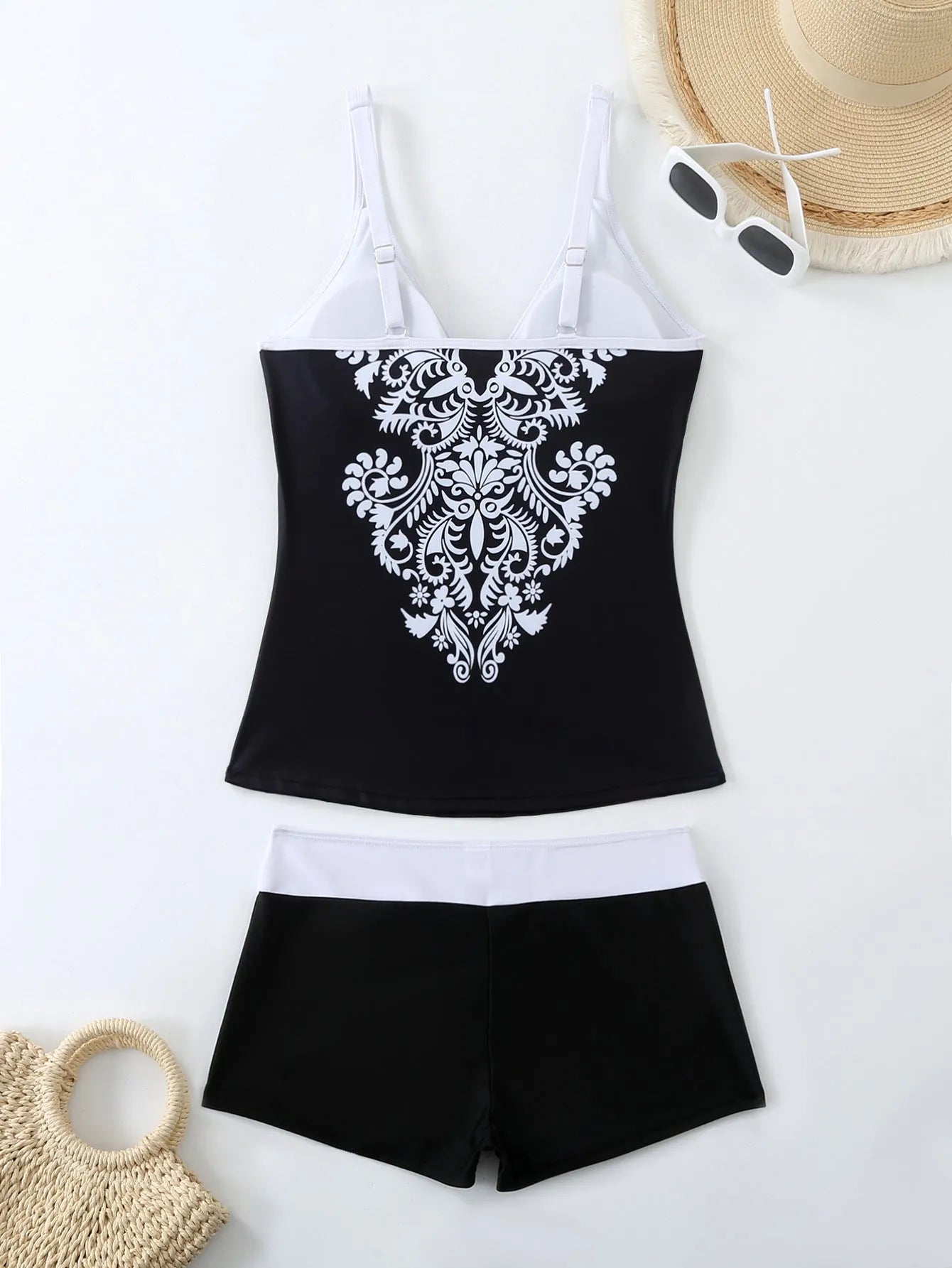 Plus size women's swimsuit set with printed briefs in black or rose red with matching swimming trunks