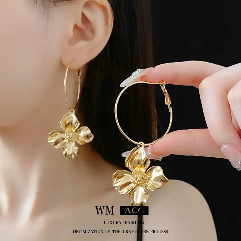 Vintage silver and gold metal flower earrings with geometric shapes and electroplated finish.
